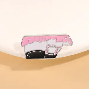 Detailed view of anime enamel pin featuring pink ruffled skirt and white stockings