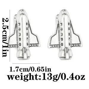 Pair of silver airplane shaped cufflinks with size and weight markers on white background