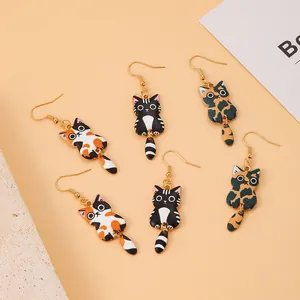 Three pairs of cute cartoon cat dangle earrings with swinging tails in various colors