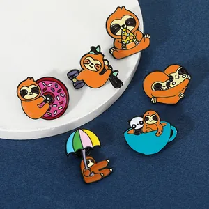 Macro detail of six creative enamel sloth pins showing colorful glaze and premium finish