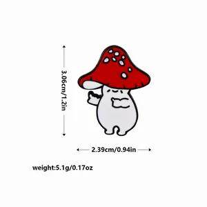 Détail du pin's champignon rouge avec dimensions 3,06 cm de hauteur et 2,39 cm de largeur