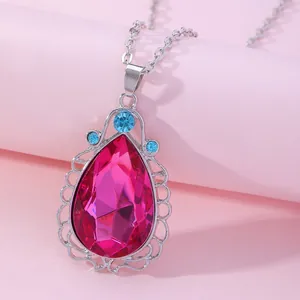 Pink waterdrop gemstone pendant with silver lace edge and light blue accent stones
