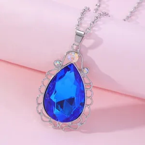 Macro shot of Sofia amulet necklace with large blue teardrop crystal and silver filigree