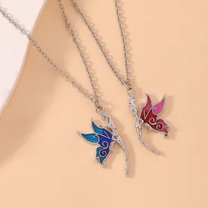 Detail of blue and pink enamel fairy wing pendant necklaces with silver O-chains