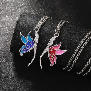 Close-up of fairy butterfly pendant necklaces with pink and blue gradient enamel details