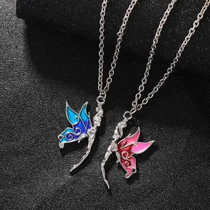 Detailed macro of enamel butterfly fairy pendants in blue and red on black leather