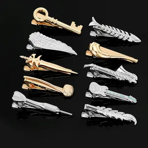 Assorted men's premium metal tie clips in gold and silver with various creative shapes
