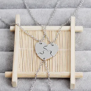 Detailed view of silver three-piece heart jigsaw puzzle necklaces for best friends