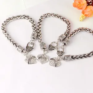 Detailed view of three silver sister bracelets with sparkling heart-shaped charms