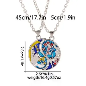 Detailed view of the 2.8cm x 2.6cm sun and moon puzzle pendants with dimensions and weights