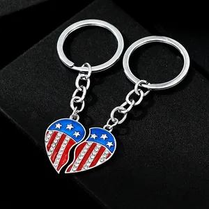 Close-up of USA flag heart puzzle keychains with blue stars and red white rhinestones