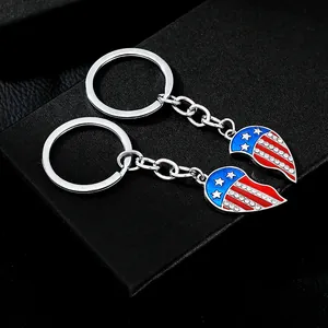 Detail view of heart-shaped US flag keychains with rhinestones on black leather box
