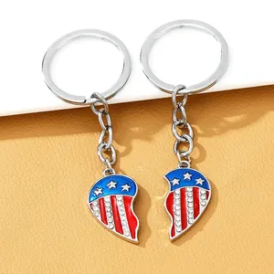 Close-up of heart-shaped USA flag keychains with sparkling rhinestones and enamel details