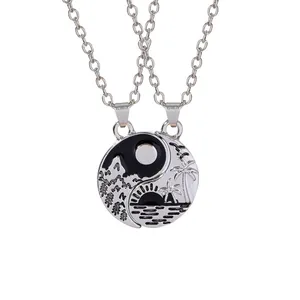Yin Yang sun and moon couple necklaces featuring mountain and sea scenery in silver finish