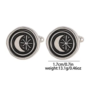 Detailed view of sun and moon vintage cufflinks with silver metal and black enamel finish