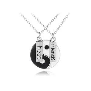 Best Friends Yin Yang split pendant necklaces with engraved tags on silver chains