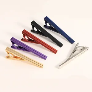 Set of six colorful polished metal business necktie clips in a minimalist sleek design