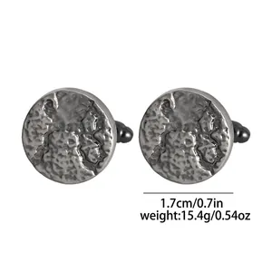 Detail view of round hammered silver cufflinks, 1.7cm diameter and 15.4g weight