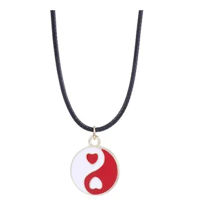 Tai Chi heart pendant necklace with red and white Yin Yang design and black cord
