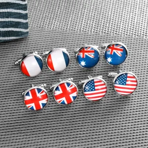 Detailed view of silver round cufflinks featuring flags of France, UK, USA and Australia