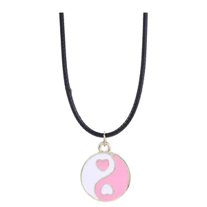 Pink and white heart-shaped Yin Yang pendant on a black cord necklace for friends