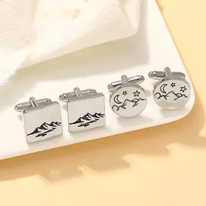 Silver cufflinks set featuring square and round mountain with crescent moon designs