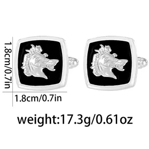 Detail view of silver metal square cufflinks with embossed horse head on black background