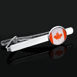 Polished silver tie clip featuring a circular Canada flag maple leaf emblem with reflections