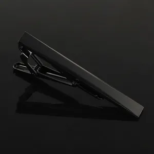 Detailed view of a sleek black alloy tie clip with a polished finish and spring mechanism