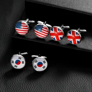 Close-up of metal cufflinks set featuring USA UK and South Korea flag patterns on leather