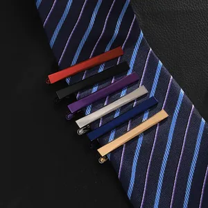Professional six-piece men's slim tie clip set in multiple metallic colors on striped tie