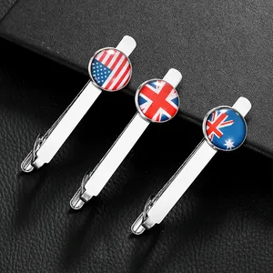 Detailed view of silver tie clips with US UK and AU national flag resin patterns