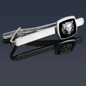 Detailed view of silver tie clip featuring a black enamel base and silver leopard head relief
