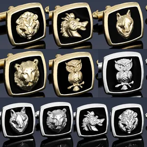 Macro detail of men's animal embossed cufflinks in gold and silver finish with enamel
