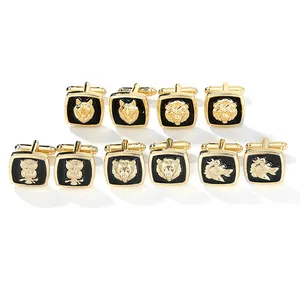 Macro view of five pairs of golden animal head cufflinks on black enamel for men
