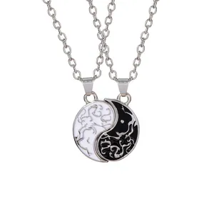 Tai Chi Yin Yang couple necklaces with black and white enamel and silver cloud patterns