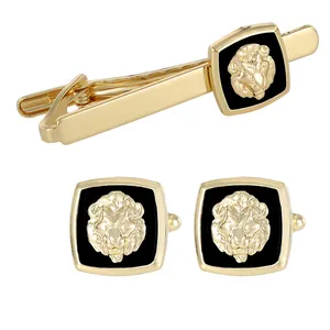 Golden lion head tie clip and cufflinks set with black enamel inlay for formal suits