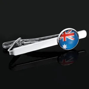 Detailed close-up of a silver tie clip with Australian flag design and mirror reflection