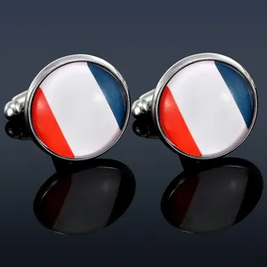 Macro shot of round French flag cufflinks with polished red white and blue enamel stripes