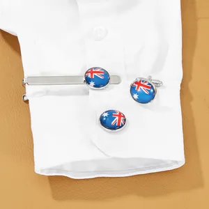 Detail of Australian flag cufflinks and tie clip set on white formal shirt cuff