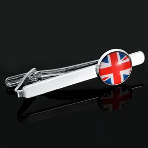 Macro shot of silver tie clip featuring a round Union Jack emblem and spring mechanism