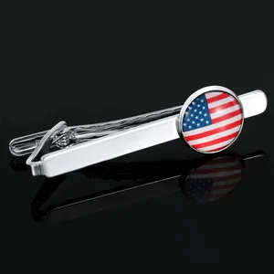 Close-up of silver necktie clip featuring a circular American flag glass dome decoration