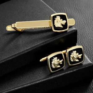 Business tie clip and cufflinks set featuring a golden horse head on black background