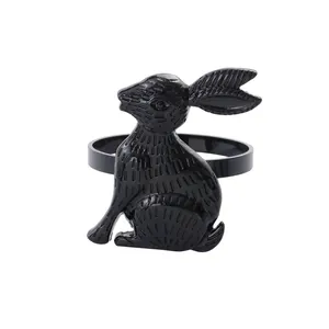Macro shot of polished black rabbit napkin ring with detailed etched line textures