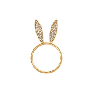 Detail of golden bunny ear napkin ring with sparkling rhinestones for Easter table decor
