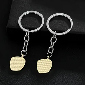 Creative alloy apple pendant keychains with textured gold finish in a black gift box