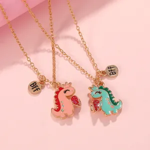 Cartoon dinosaur magnetic BFF necklaces with crowns and glitter heart pendants