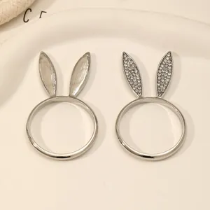 Silver rabbit ear napkin rings set with one smooth finish and one crystal encrusted ring