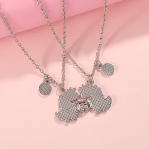 Magnetic dinosaur best friend necklaces with silver plating and heart dot texture