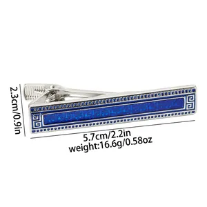 Detail view of silver tie clip with blue geometric pattern showing size 5.7cm x 2.3cm